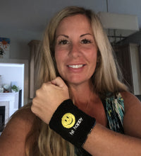 Load image into Gallery viewer, A woman wearing a black Hit Happy Pickleball Wristband