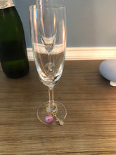 Load image into Gallery viewer, A purple Pickleball Wine Glass Charm on a glass