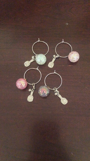A video showing the 4 different Pickleball Wine Glass Charms