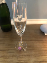 Load image into Gallery viewer, A purple Pickleball Wine Glass Charm on a glass
