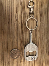 Load image into Gallery viewer, The Pickleball Paddle Bottle Opener and Keychain next to a quarter to show its size

