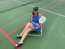 Load image into Gallery viewer, A woman wearing the black Hit Happy Mesh Pickleball Visor on the court
